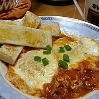 recipe Poached Eggs in Tomato Sauce with Garlic Bread